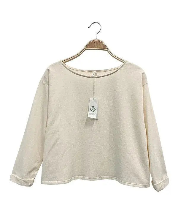 Organic Hemp Meditate T long sleeve cream hemp and organic cotton blend shirt hanging on wooden hanger